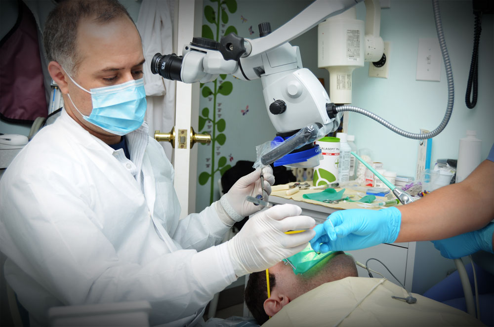 Dr. Mattew Malek giving treatment to a patient