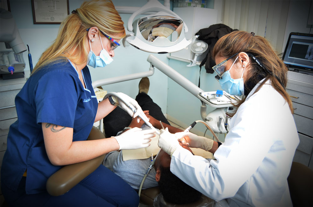 Dr. Shahpari Nazeri giving treatment to a patient